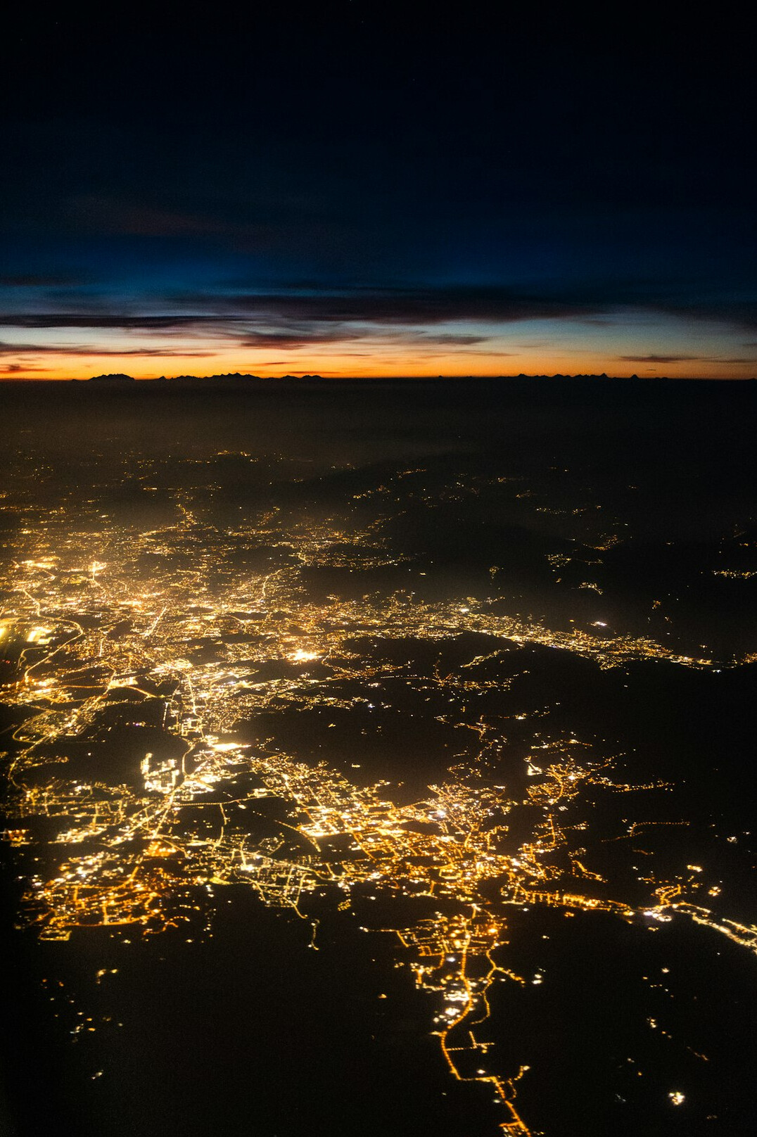 Global network of glowing connection lines over the earth at night