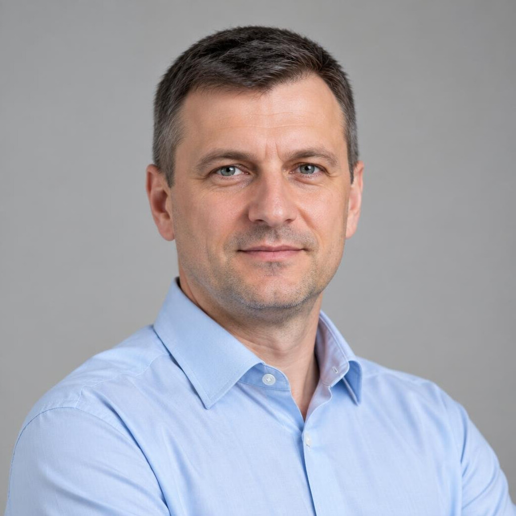 Portrait of a Caucasian man in a collared shirt