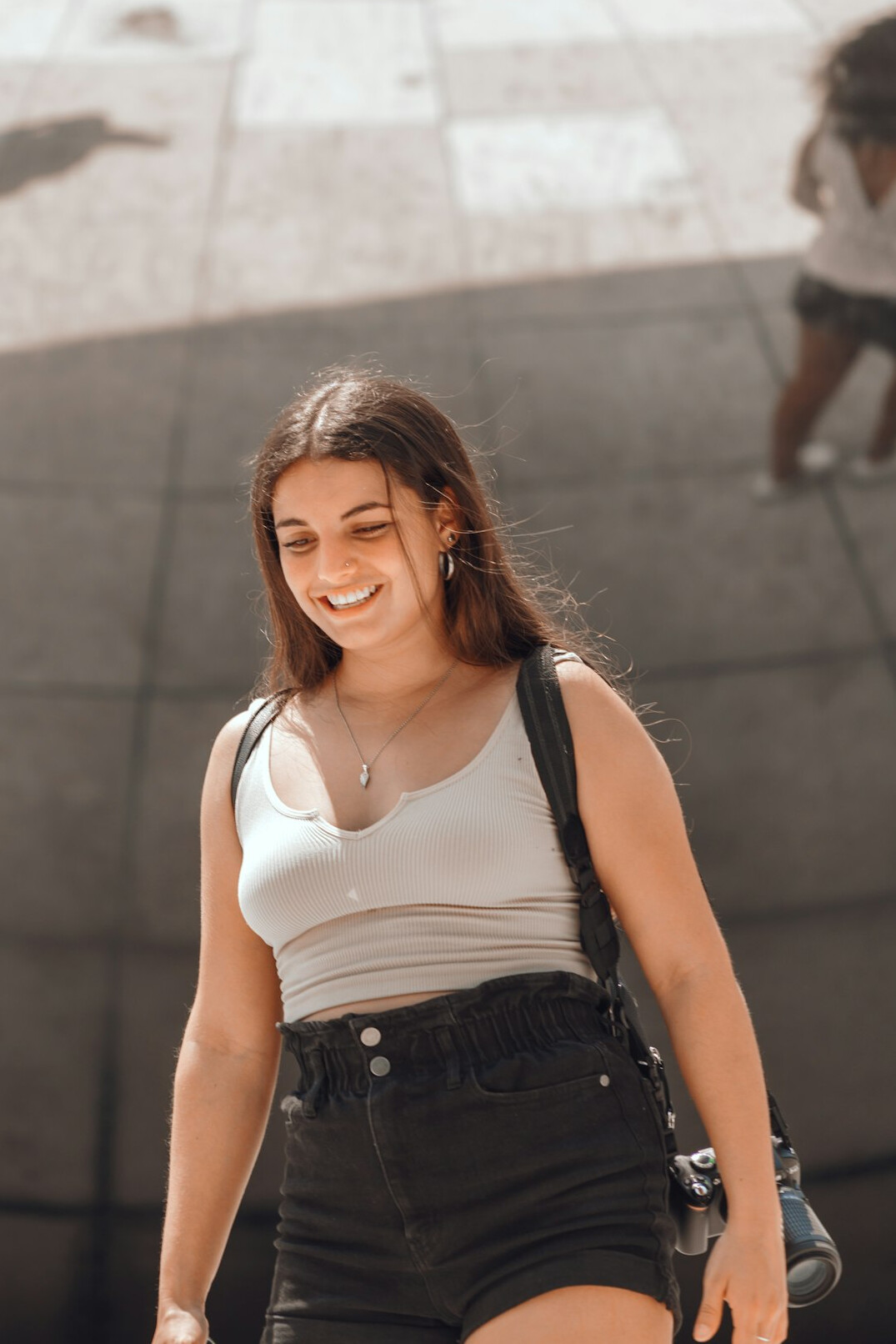 Portrait of a Caucasian woman with long brown hair smiling